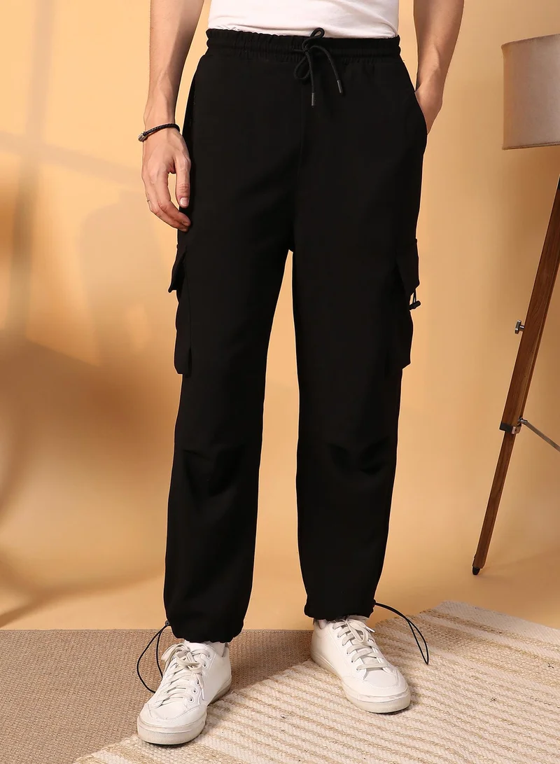 كامبوس سوترا Men's Onyx Black Solid Cargo Parachute Trousers For Casual Wear | 4 Pockets | Mid-Rise | Button Closure | Cargo Pants Crafted With Comfort Fit For Everyday Wear